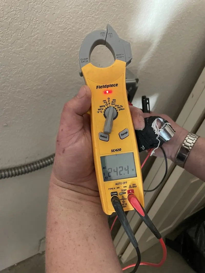 Voltage testing with clamp meter during Electrical Installation Services in Fox River Grove